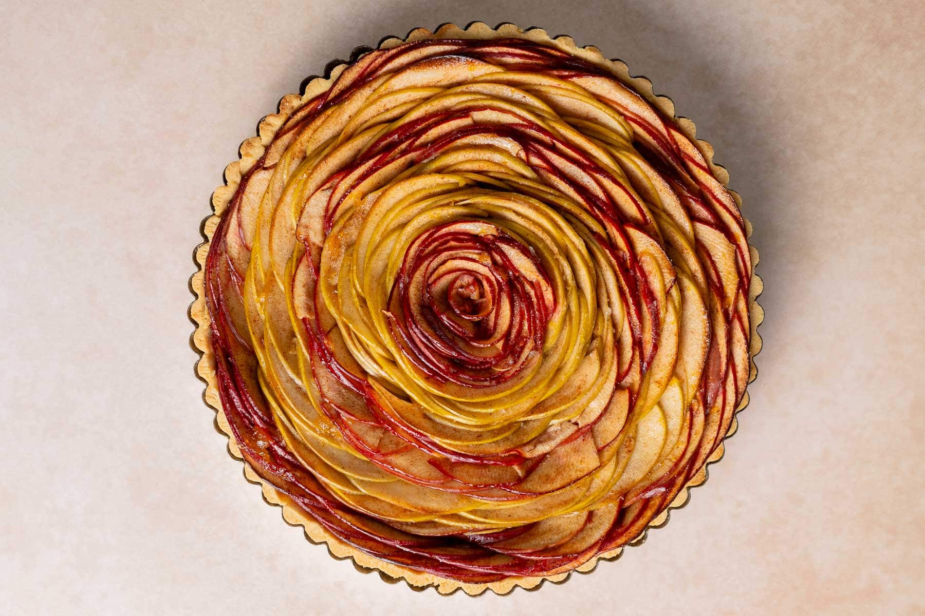 Baked apple tart with glaze.