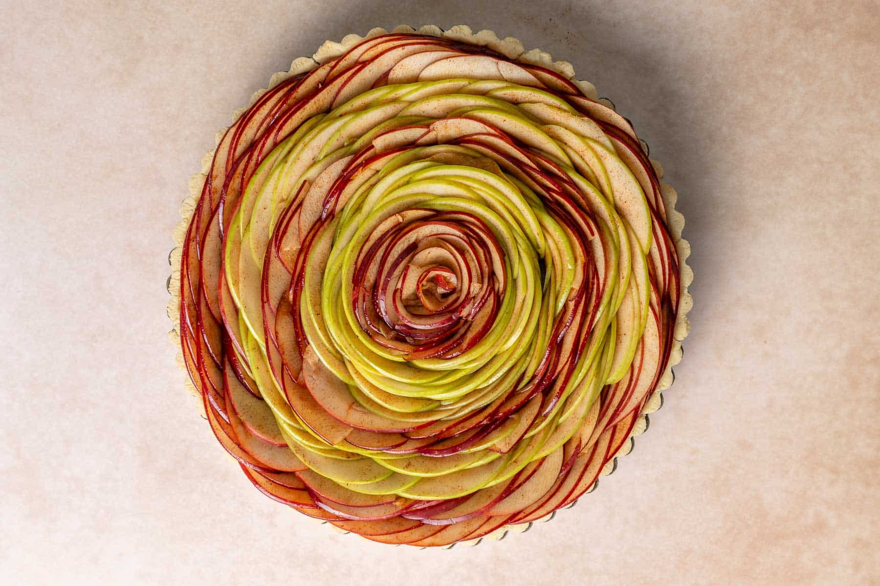The apple slices arranged upright in a circular pattern.