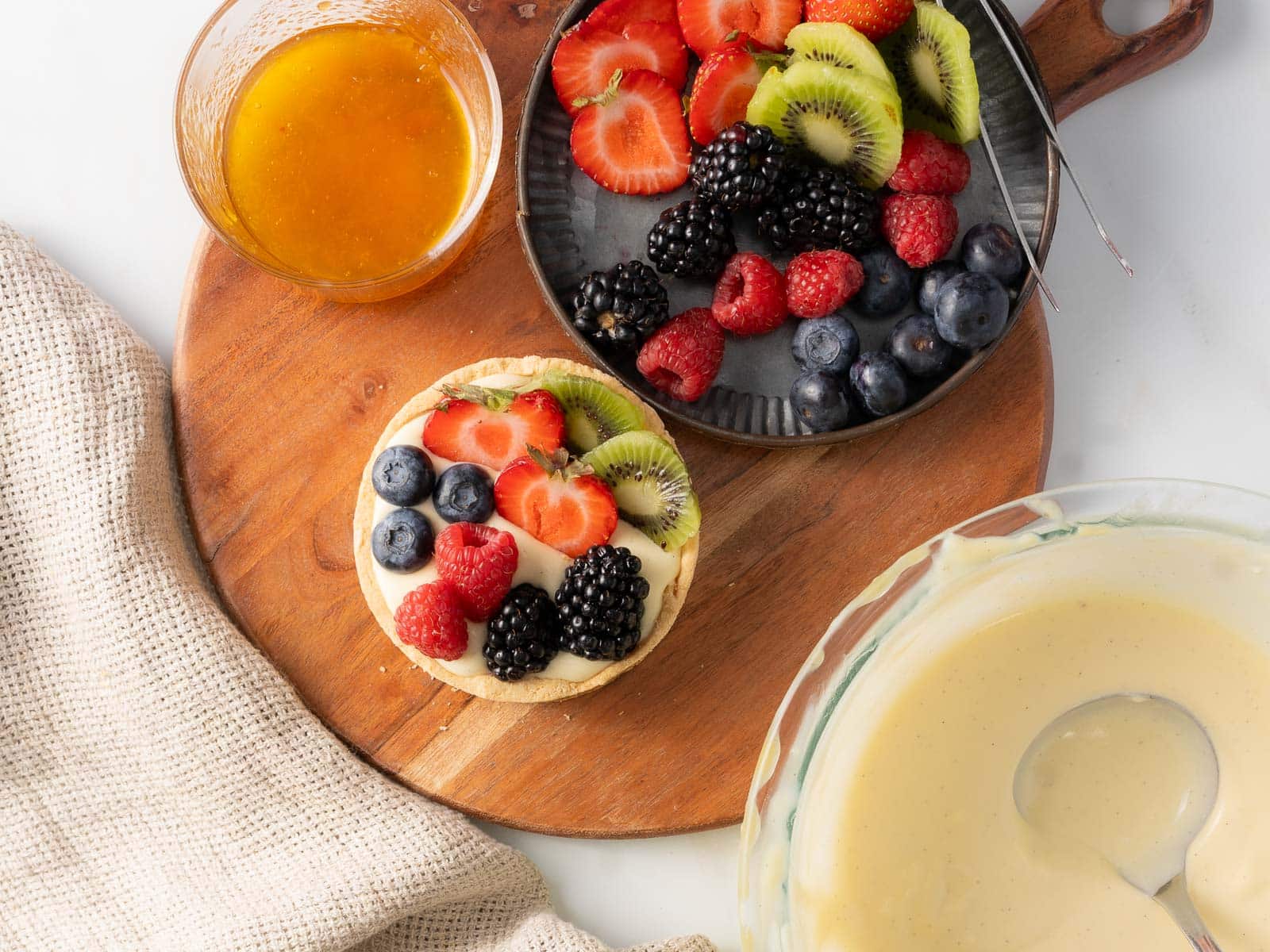 Add the fruit on top of the custard.