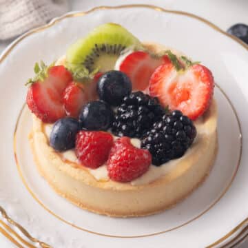 Gluten free fruit tart on a plate.