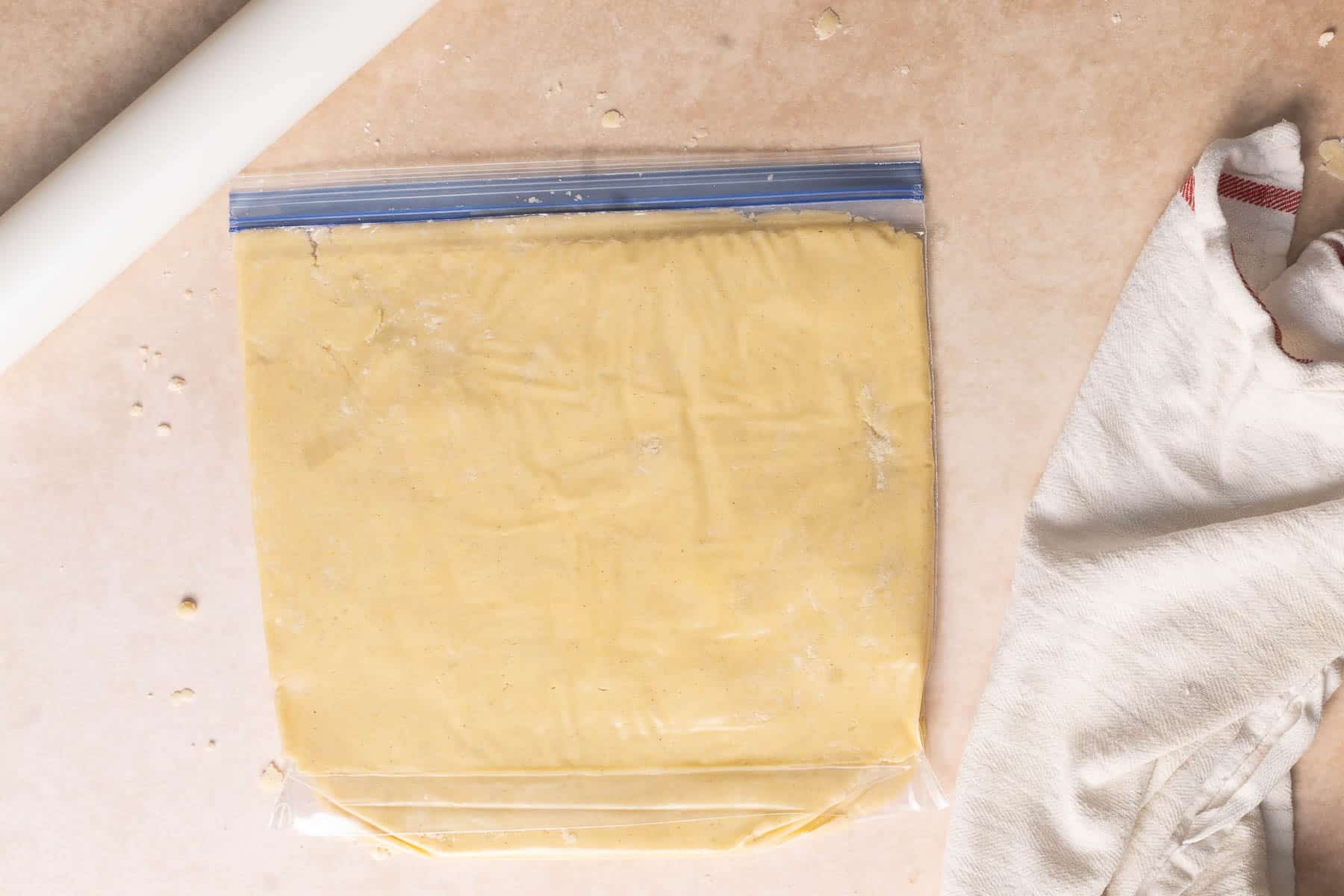 Storing dough in plastic before chilling.