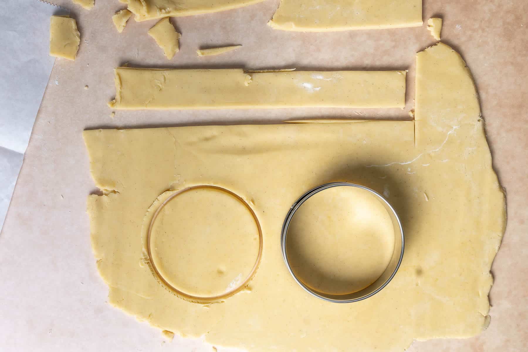 Cutting the dough to fit tart rings.