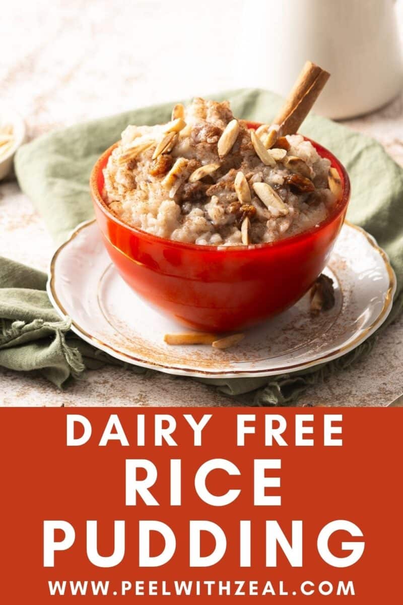 A bowl of dairy-free rice pudding topped with nuts and a cinnamon stick sits on a white plate with a green cloth underneath. Text reads "Dairy Free Rice Pudding" with a website link "www.peelwithzeal.com".