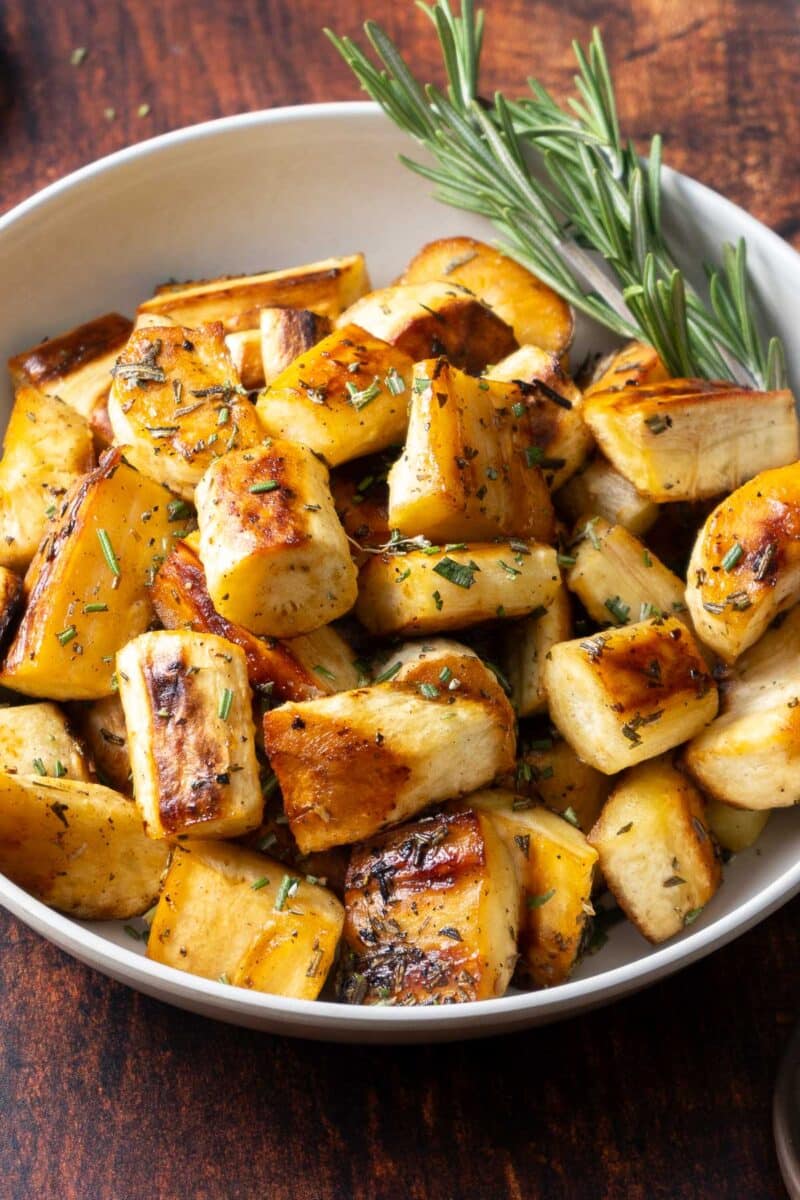 Parsnips with rosemary in a serving bowl.