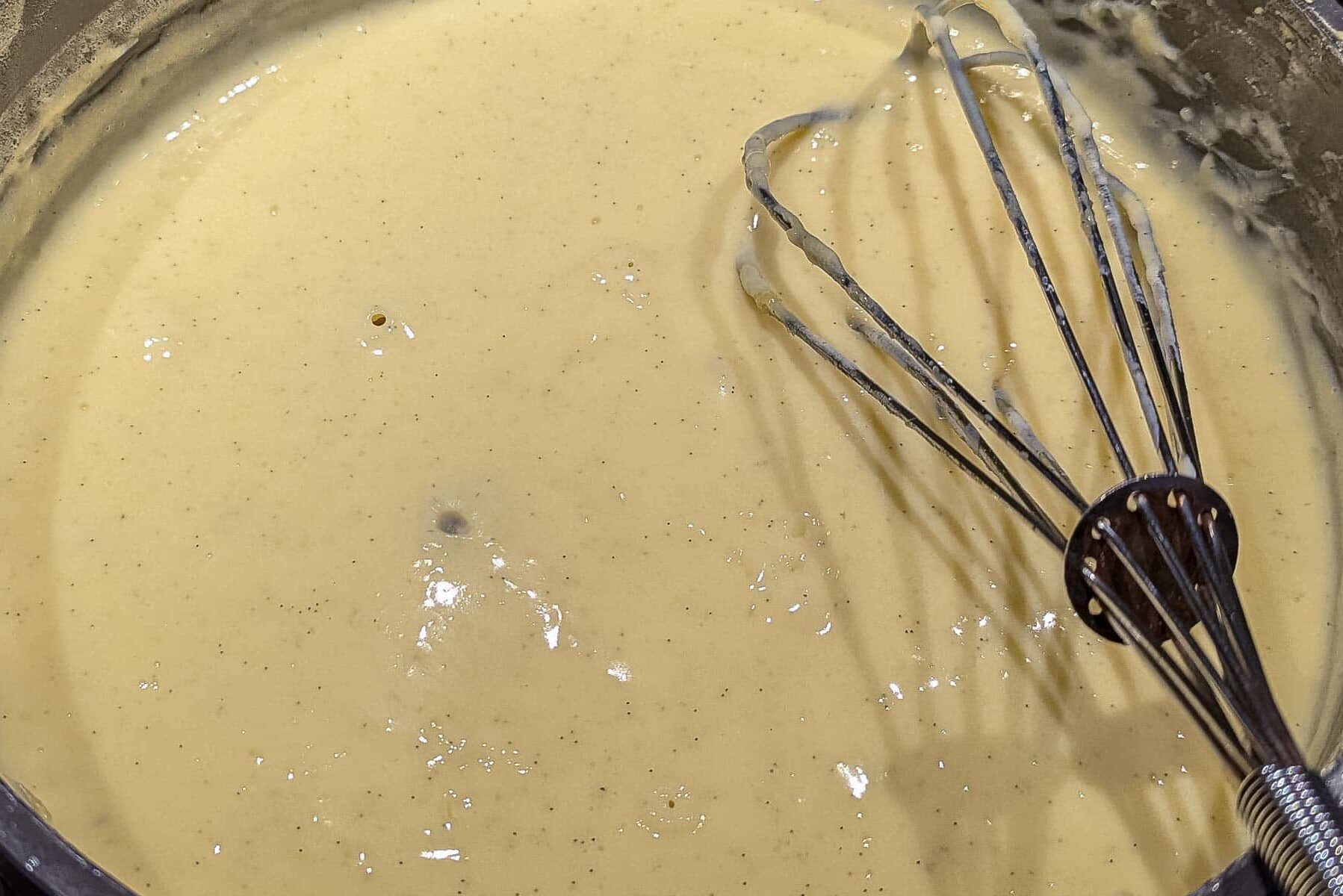 Cooking pastry cream until it bubbles.