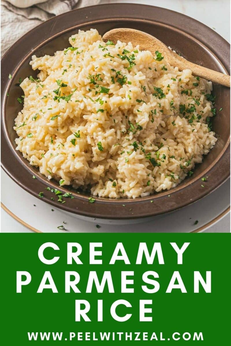 A bowl of creamy Parmesan rice garnished with herbs, with a wooden spoon on the side. Text reads: "Creamy Parmesan Rice www.peelwithzeal.com.
