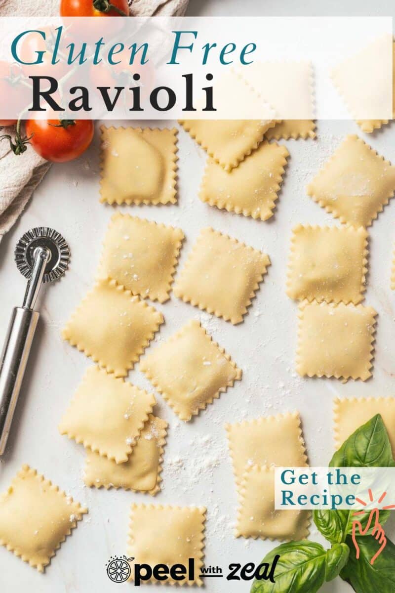 Gluten-free ravioli pieces rest enticingly on a countertop alongside a pasta cutter, with vibrant cherry tomatoes and fresh basil leaves lending a splash of color. Text reads "Gluten Free Ravioli" and "Get the Recipe.
