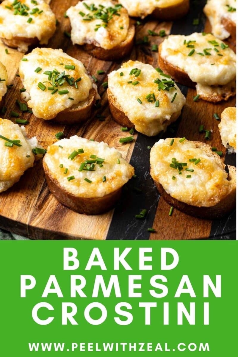 Close-up of baked Parmesan crostini topped with chopped chives on a wooden board. Text on the image reads "Baked Parmesan Crostini" and "www.peelwithzeal.com".
