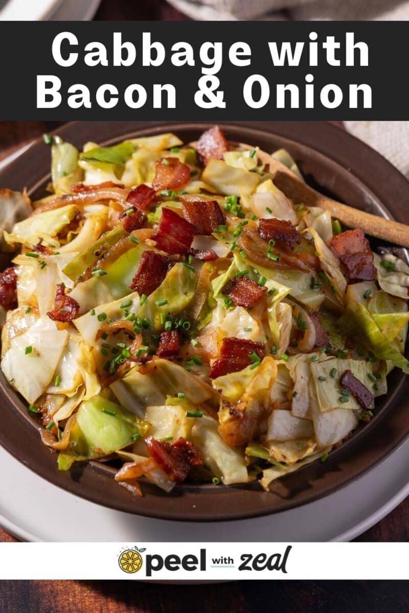 A savory bowl of cabbage intertwined with crispy bacon and sweet onions, all beautifully garnished with a sprinkle of fresh chives.