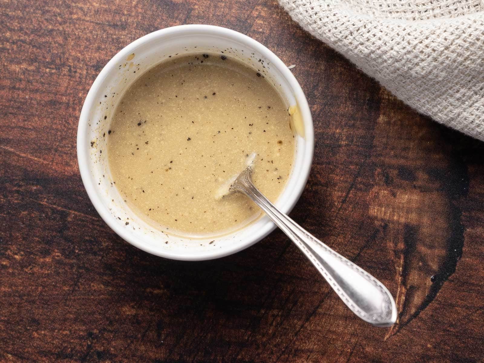 A mustard dressing before adding to the pan.