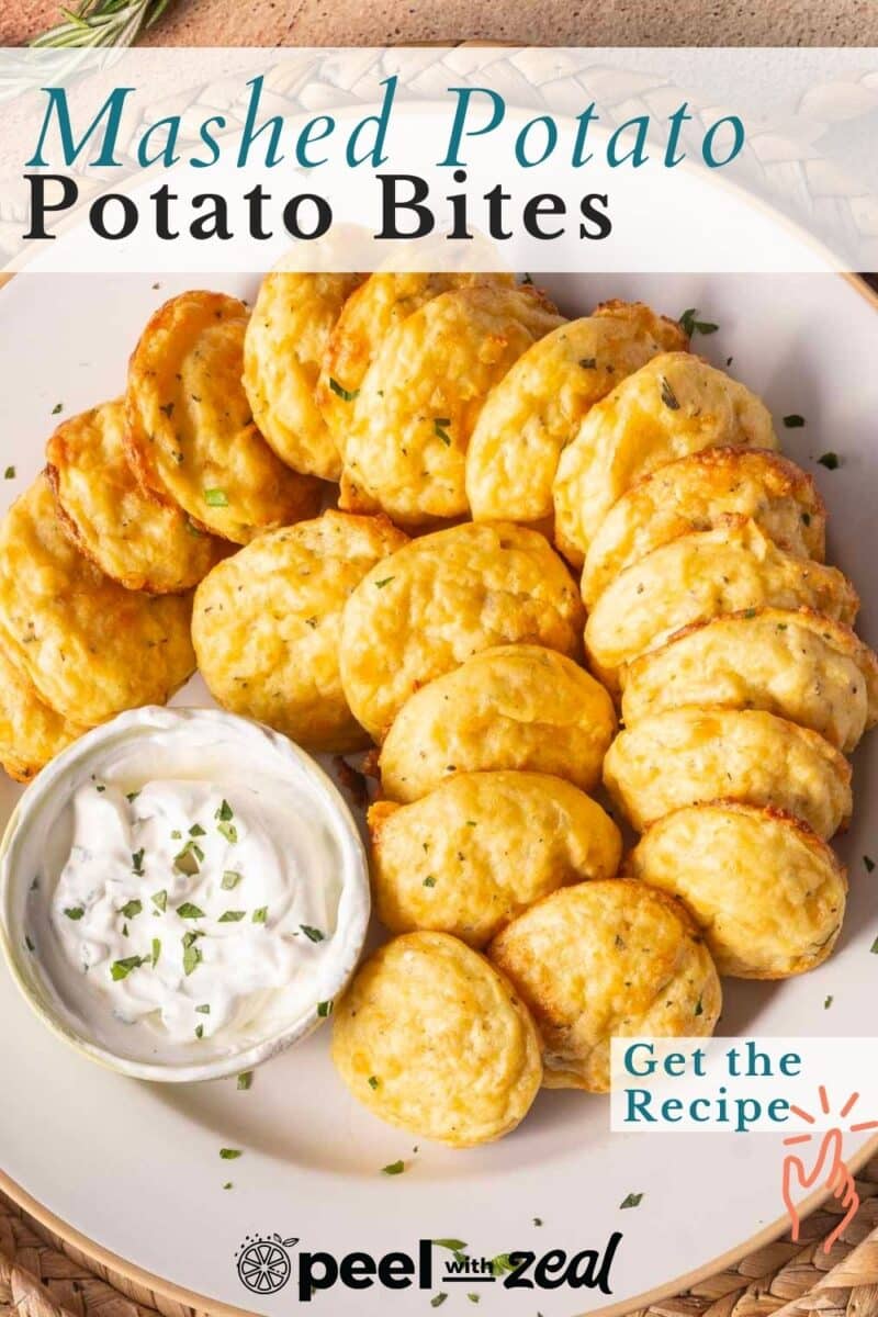 A plate of mashed potato bites with a small bowl of dipping sauce, garnished with herbs. Text reads "Mashed Potato Bites" and "Get the Recipe.