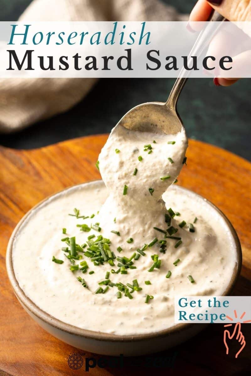 A spoon scoops creamy horseradish mustard sauce, beautifully garnished with chopped chives in a bowl, inviting you to click the "Get the Recipe" button.