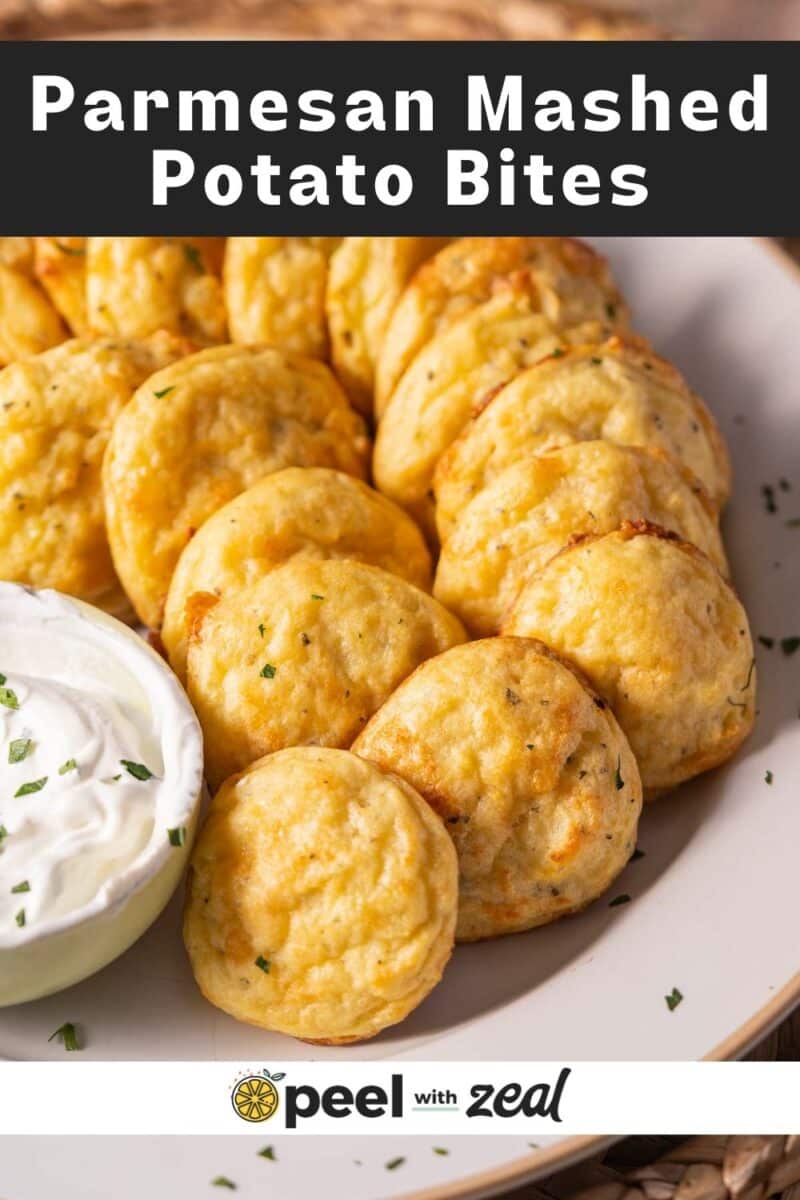 Plate of golden Parmesan mashed potato bites with a side of white dipping sauce.
