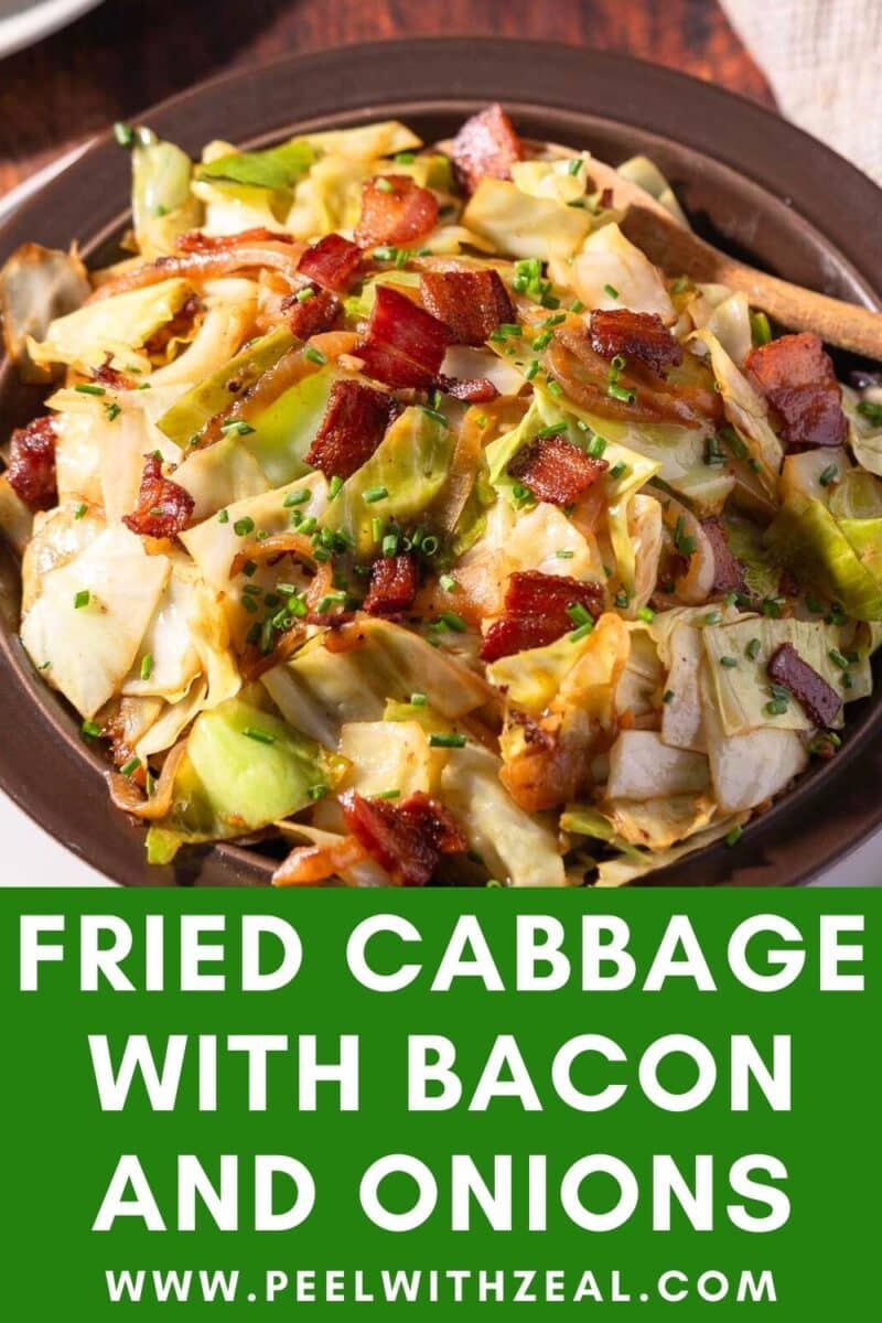 A bowl of savory fried cabbage with crispy bacon and onions, garnished with fresh chives. Text on the image reads: "Fried Cabbage with Bacon and Onions www.peelwithzeal.com.