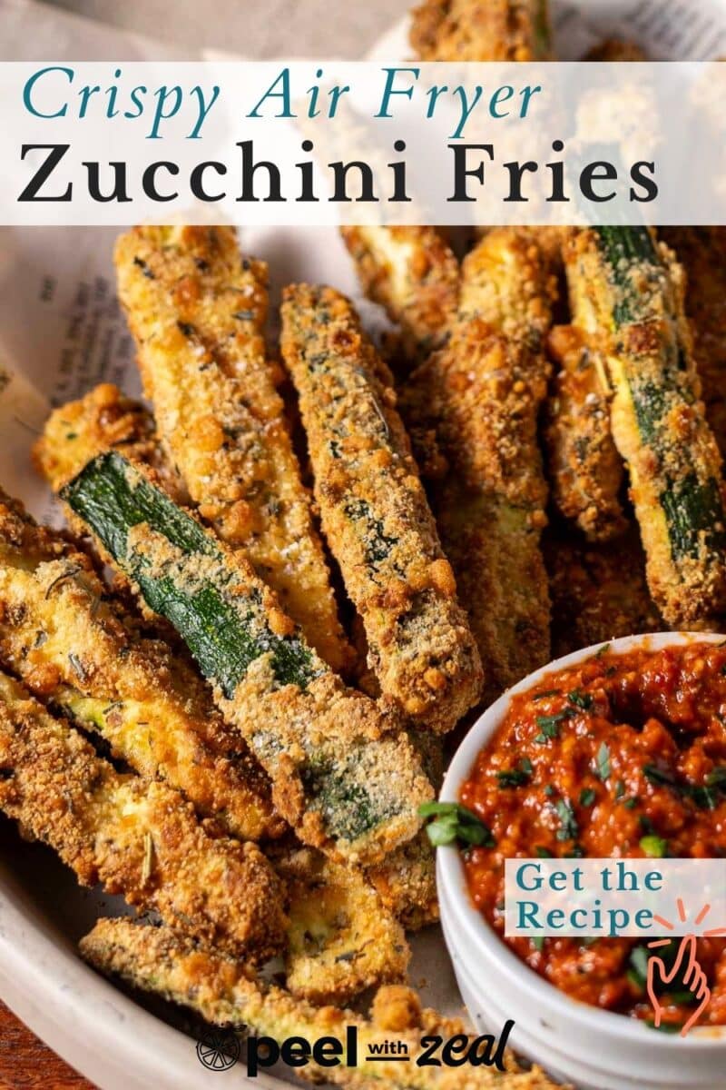A bowl of crispy zucchini fries with dipping sauce, accompanied by text: "Crispy Air Fryer Zucchini Fries" and "Get the Recipe.