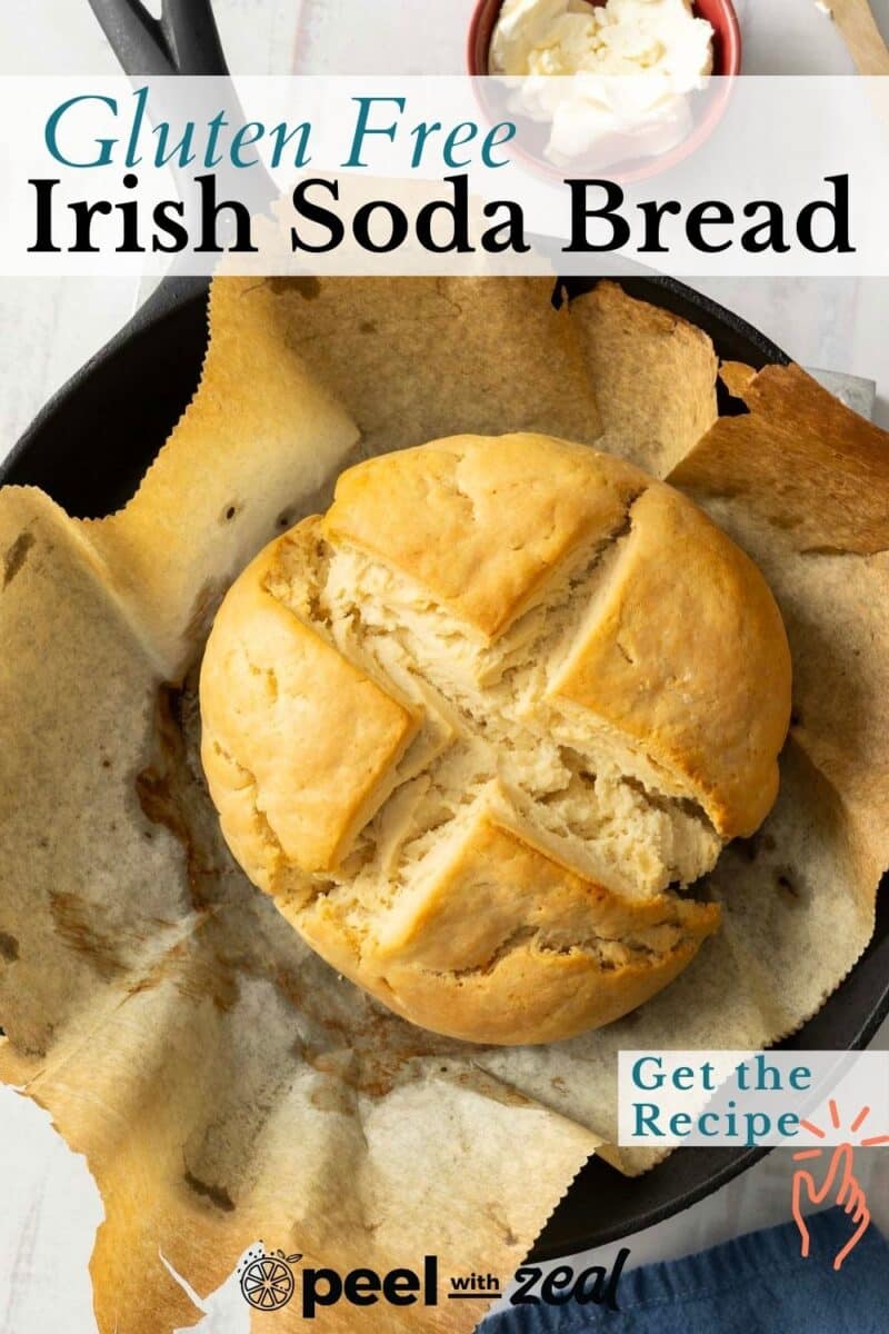 Round gluten-free Irish soda bread with a cross on top, in a skillet lined with parchment paper, with a butter dish nearby. Text reads "Gluten Free Irish Soda Bread" and "Get the Recipe.