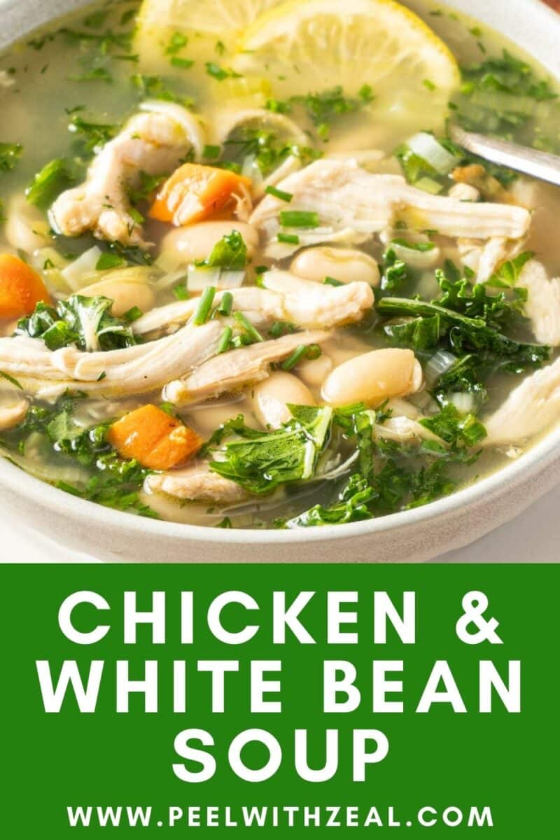 Bowl of chicken and white bean soup with carrots and greens, garnished with a lemon slice. Text at bottom: "CHICKEN & WHITE BEAN SOUP, www.peelwithzeal.com.