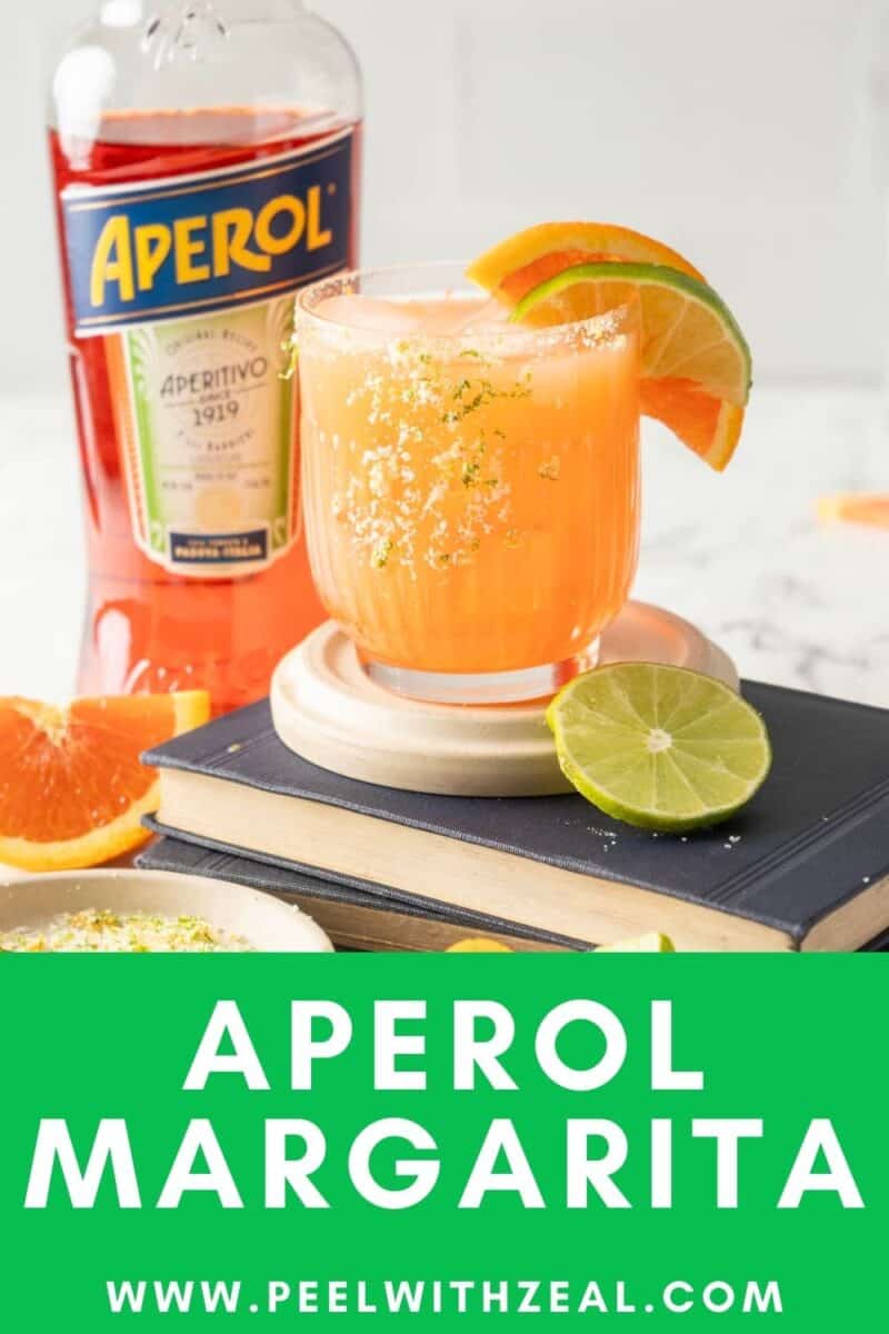 A refreshing Aperol margarita, perfectly garnished with lime and orange slices, sits invitingly beside a bottle of Aperol. Discover more at www.peelwithzeal.com.