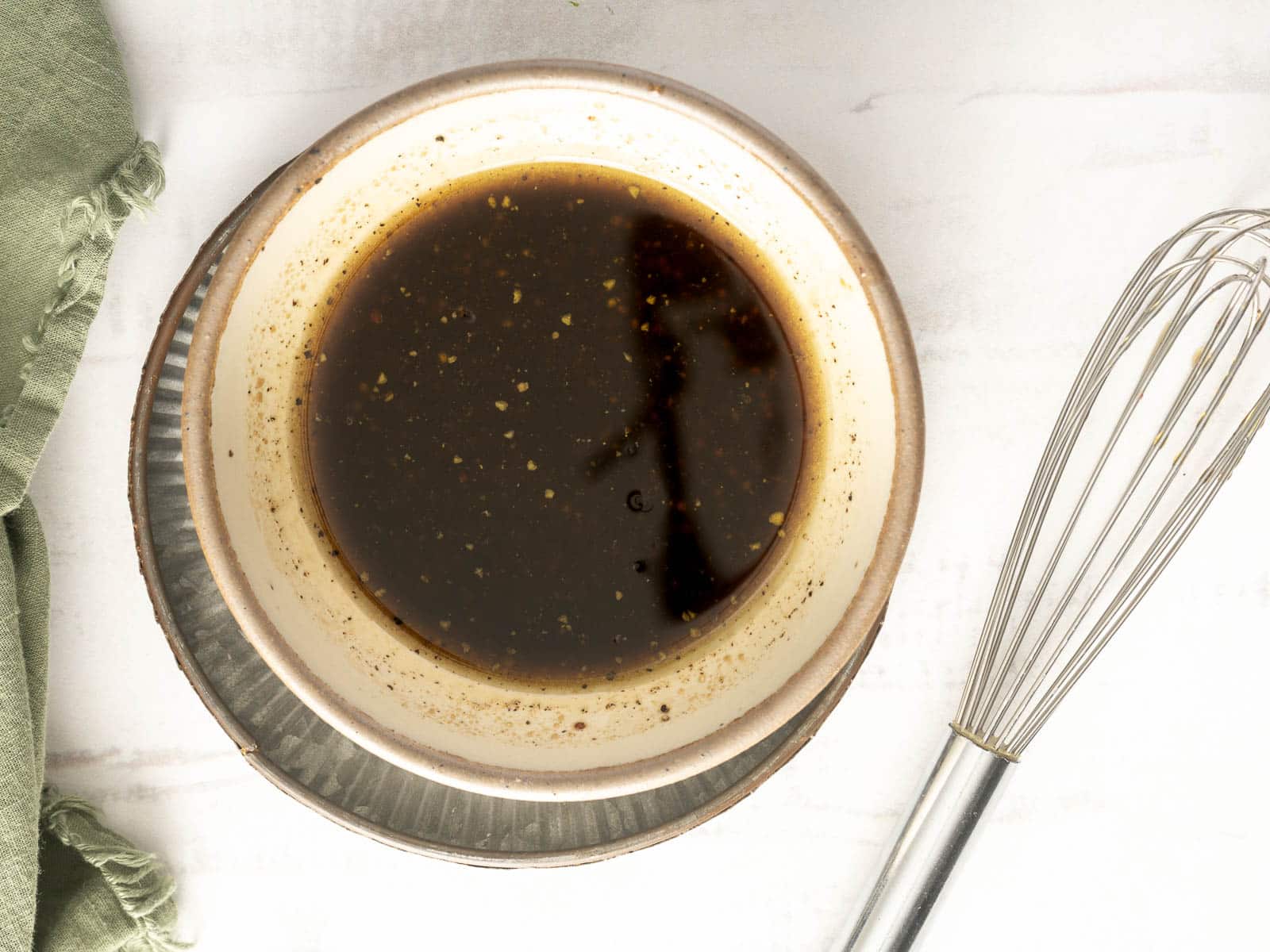 Balsamic dressing in a small bowl.