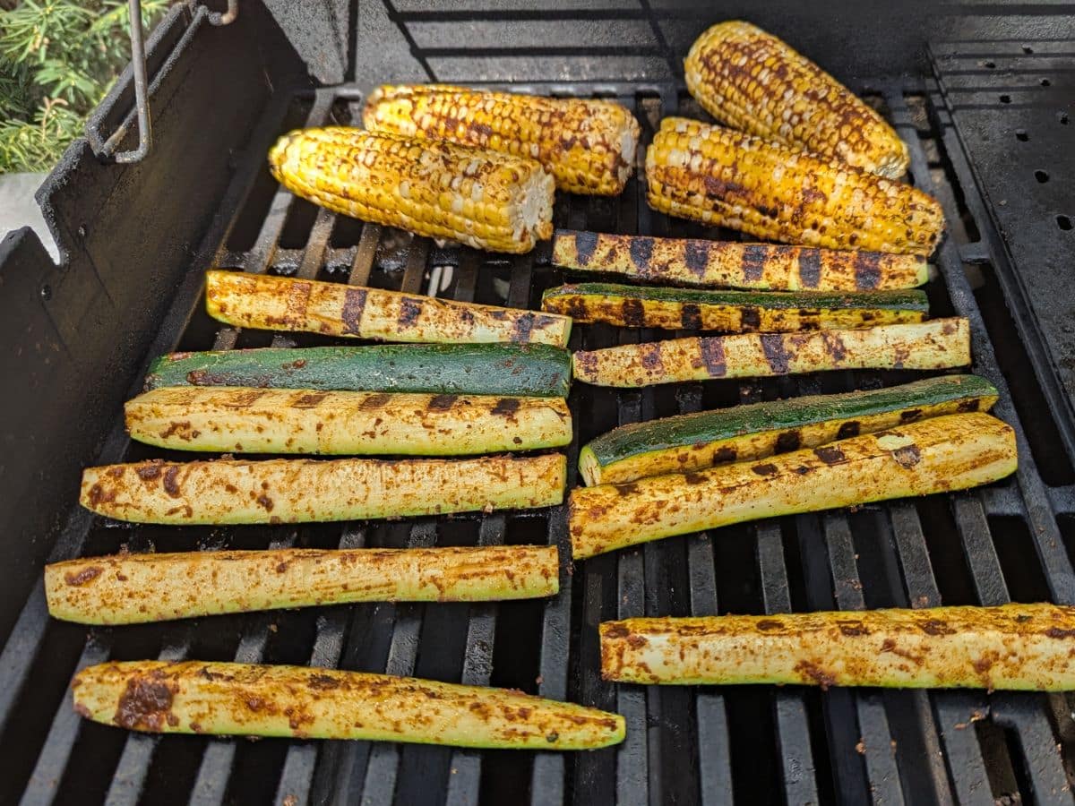 Corn on the cob and sliced zucchini with grill marks sizzle on the barbecue, just perfect for tossing into a fresh corn and zucchini salad.