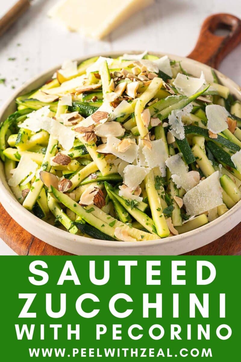 A bowl of deliciously sautéed zucchini topped with shaved pecorino cheese and almonds.