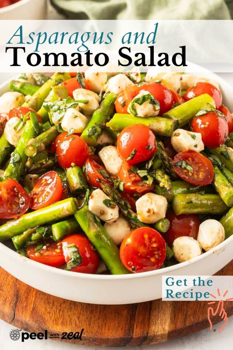 A bowl of fresh asparagus and tomato salad with creamy mozzarella, beautifully garnished with fragrant herbs. Tempt your taste buds—get the recipe!.