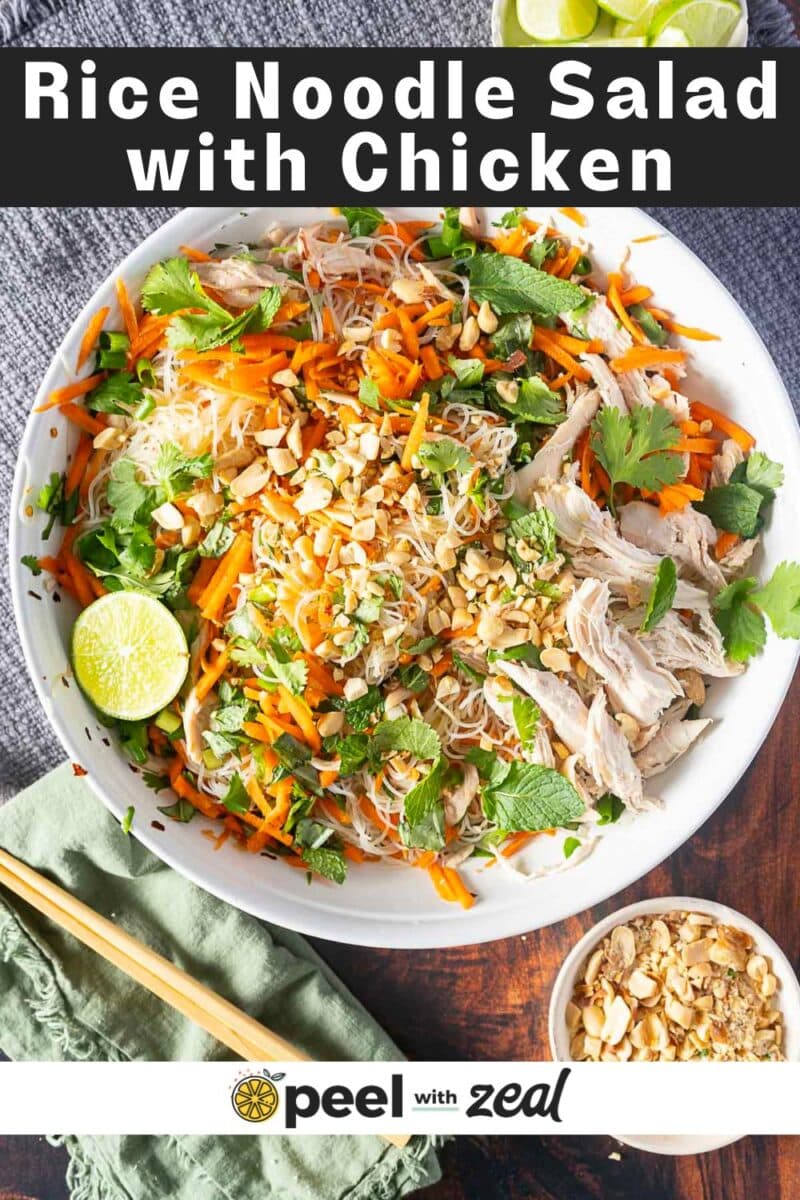 A vibrant bowl of rice noodle salad featuring shredded chicken, carrot, peanuts, herbs, and a zesty hint of lime. Text on image: "Rice Noodle Salad with Chicken" and "peel with zeal".