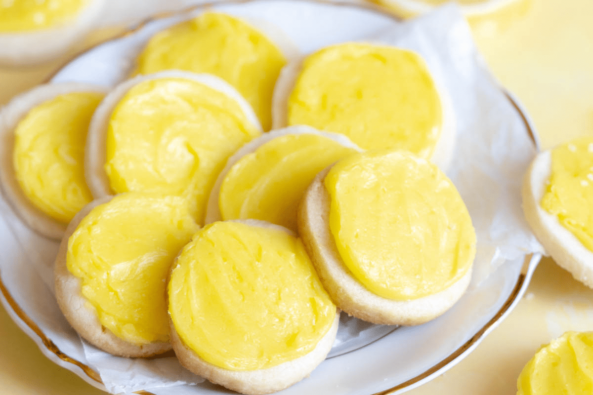 A plate of sugar cookies topped with smooth, yellow frosting makes the perfect choice for Easter desserts.