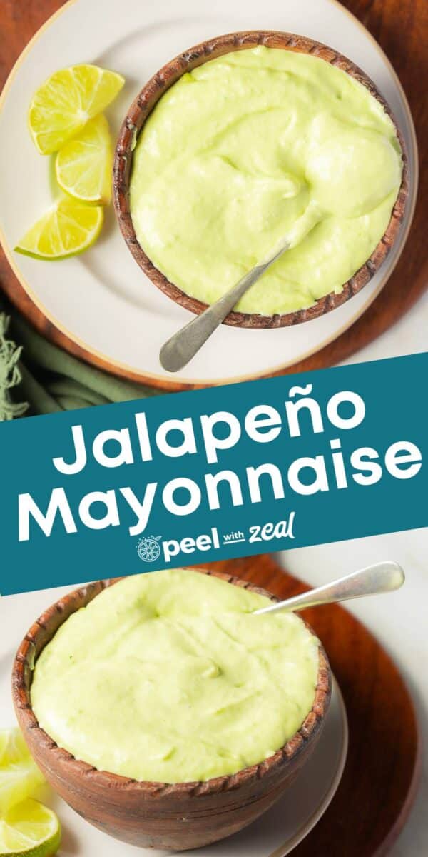 A bowl of creamy jalapeno mayo with a spoon, served alongside fresh lime wedges on a plate.