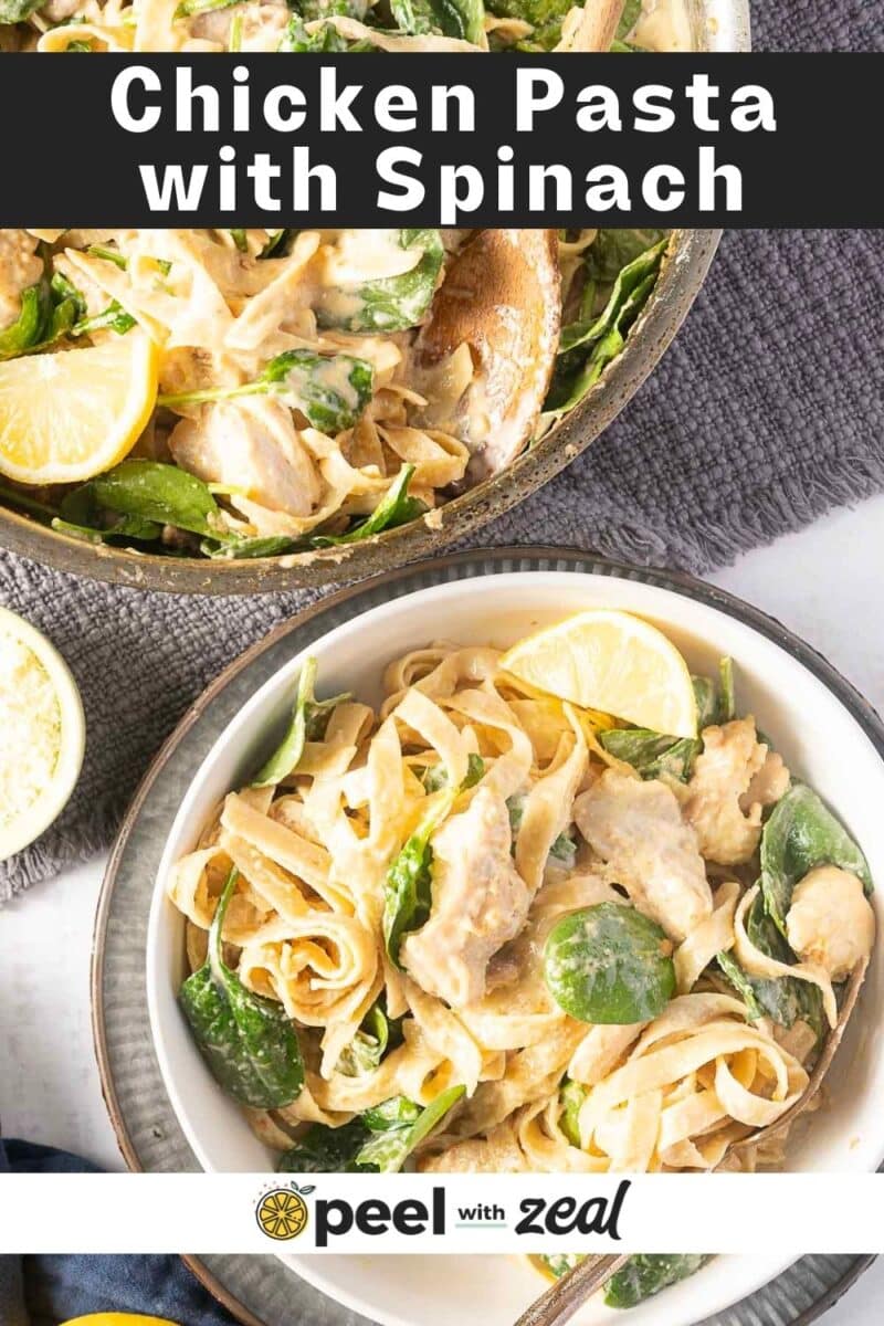 Two bowls of lemon chicken pasta with spinach, garnished with lemon wedges. A wooden spoon rests in one bowl.