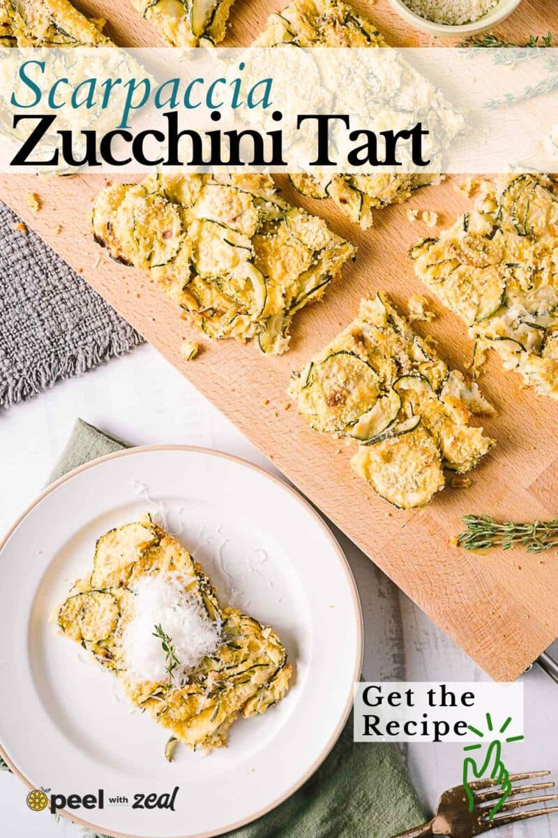 Overhead view of sliced zucchini tart, reminiscent of scarpaccia, on a wooden board and a single serving on a plate garnished with cheese and herbs.