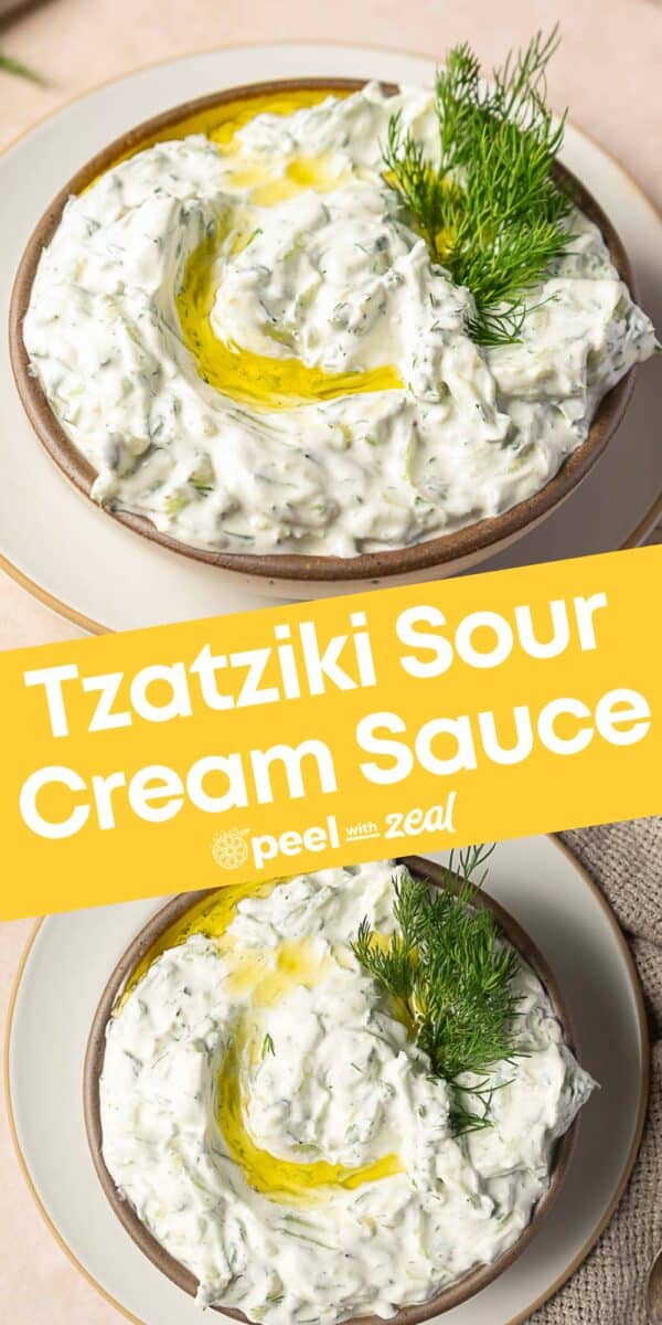 A bowl of Tzatziki Sauce with Sour Cream, garnished with fresh dill and a drizzle of olive oil, is shown from above on a plate.