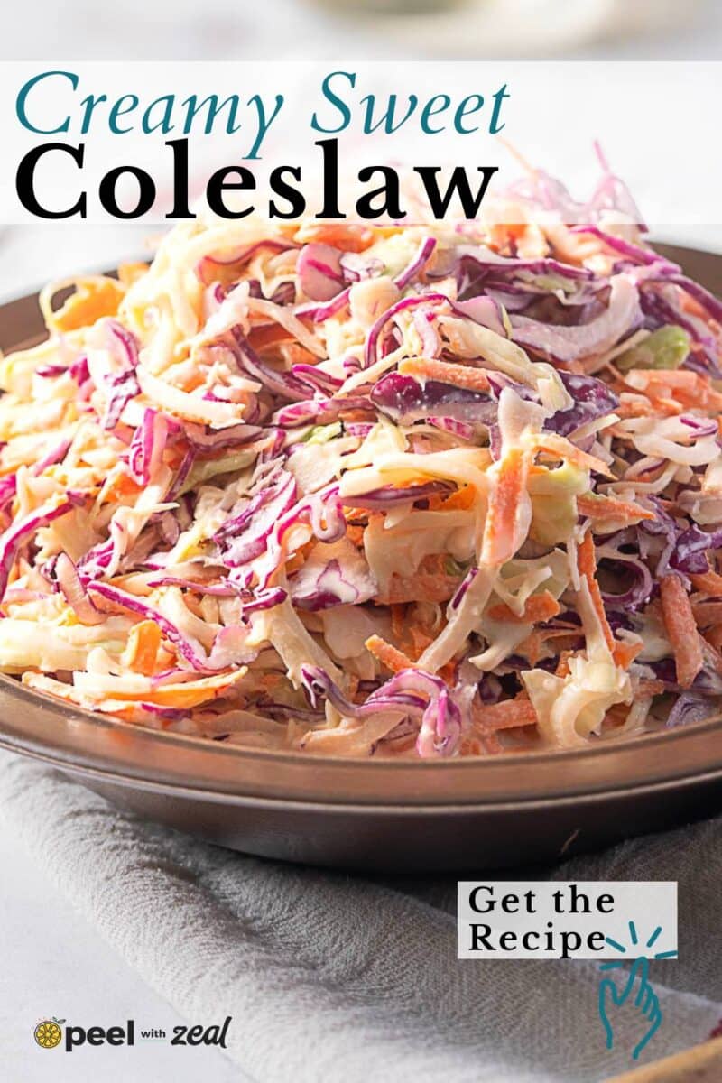 A plate of creamy coleslaw with shredded purple cabbage, green cabbage, and carrots is presented on a brown dish, perfect for anyone seeking a sweet coleslaw recipe.