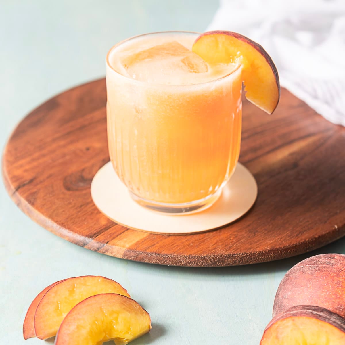 peach mezcal cocktail in a glass