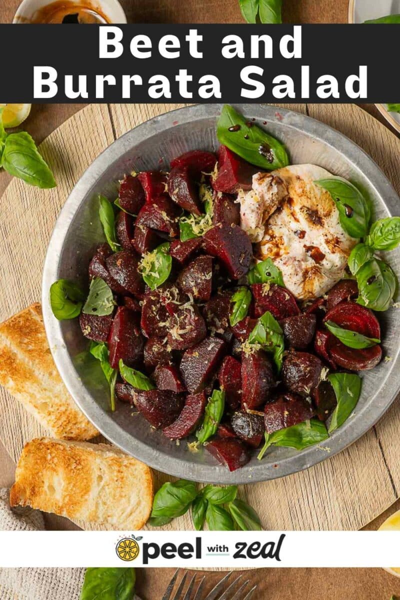 A plate of beet and burrata salad with fresh basil leaves, served with toasted bread slices on the side, makes for a vibrant appetizer.