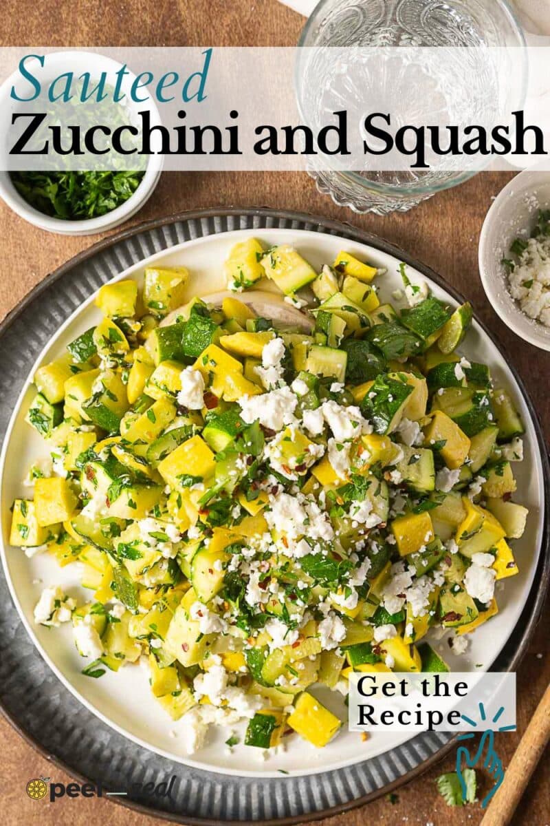 A plate of sautéed zucchini and squash garnished with crumbled cheese and herbs is surrounded by small bowls of chopped herbs, extra cheese, and a glass of water. This vibrant dish highlights the flavors of sauteed zucchini and squash.