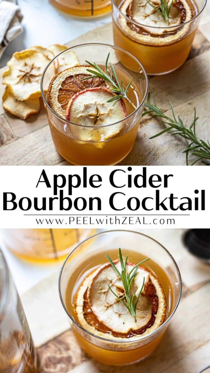 A bourbon apple cider cocktail garnished with dried apple and orange slices plus a rosemary sprig sits on a wooden board.