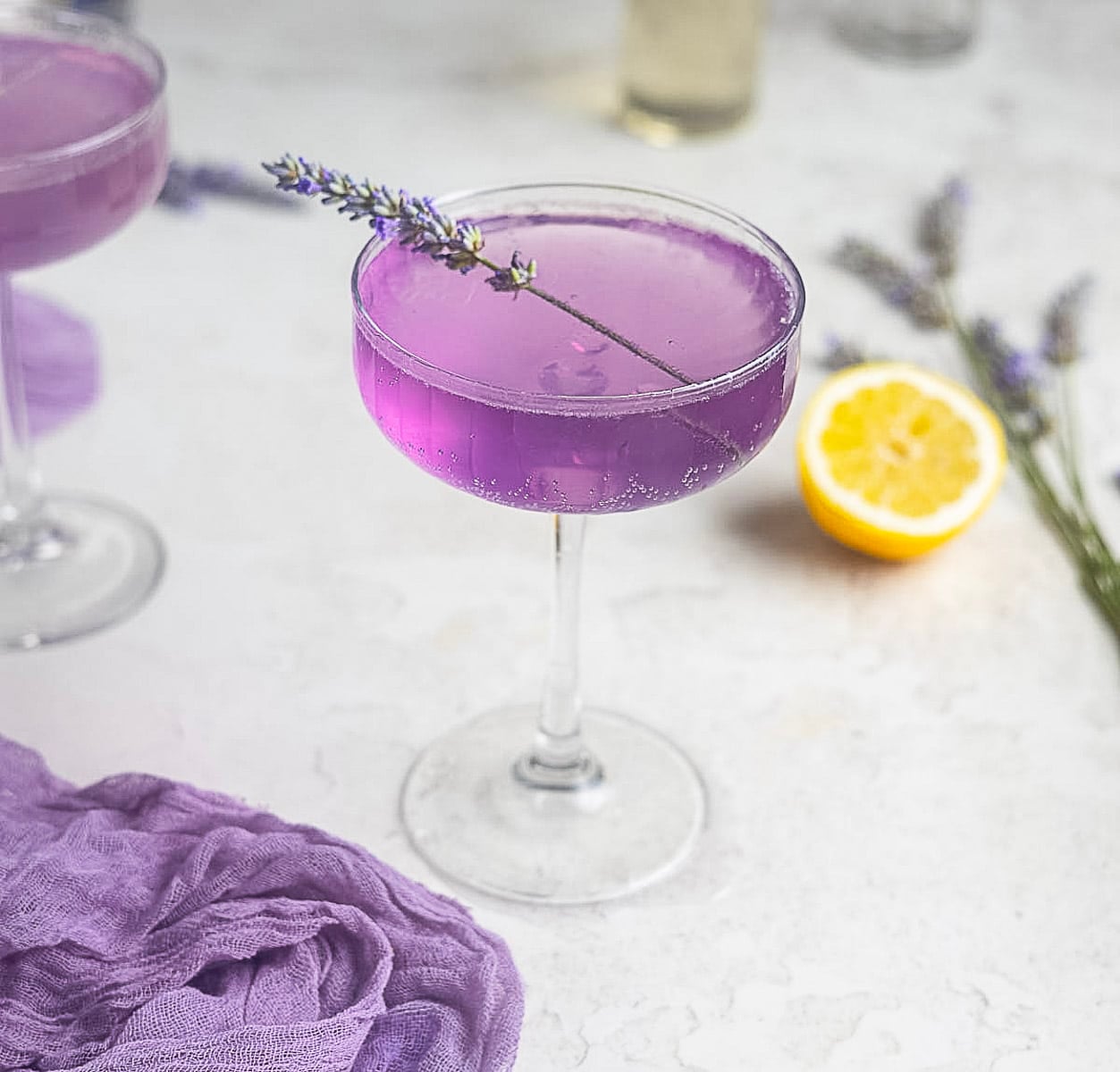 lavender french 75 in a cocktail glass