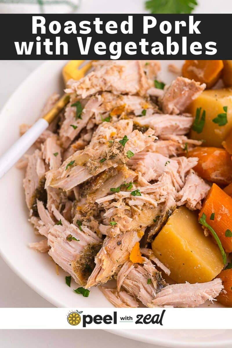 A plate of slow cooker pork roast served with chunks of potatoes and carrots, garnished with chopped parsley.