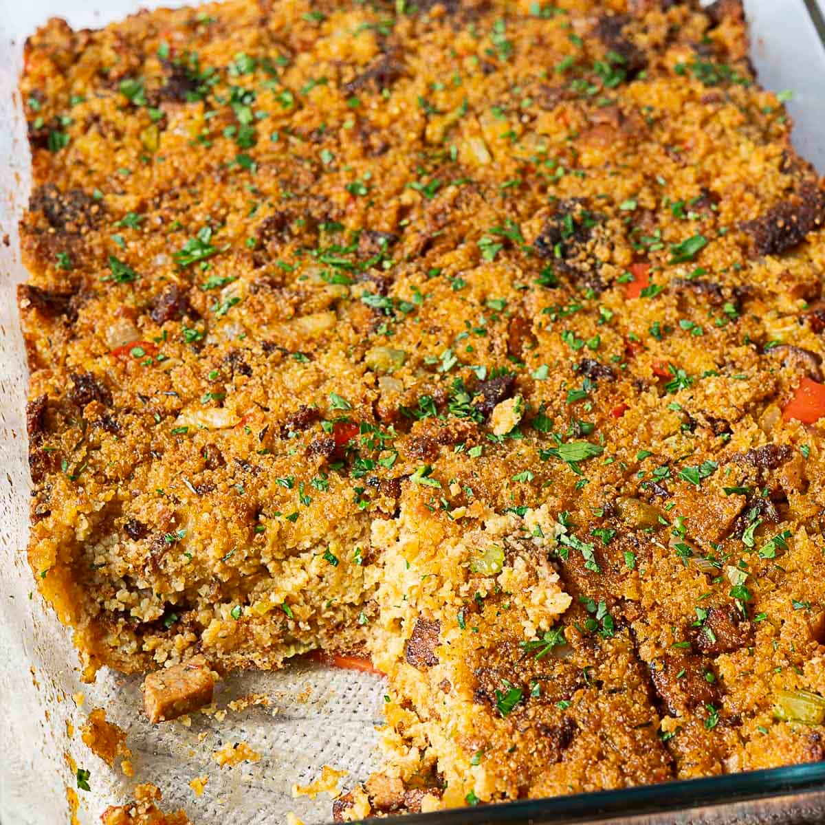 cajun cornbread dressing in a transparent baking dish