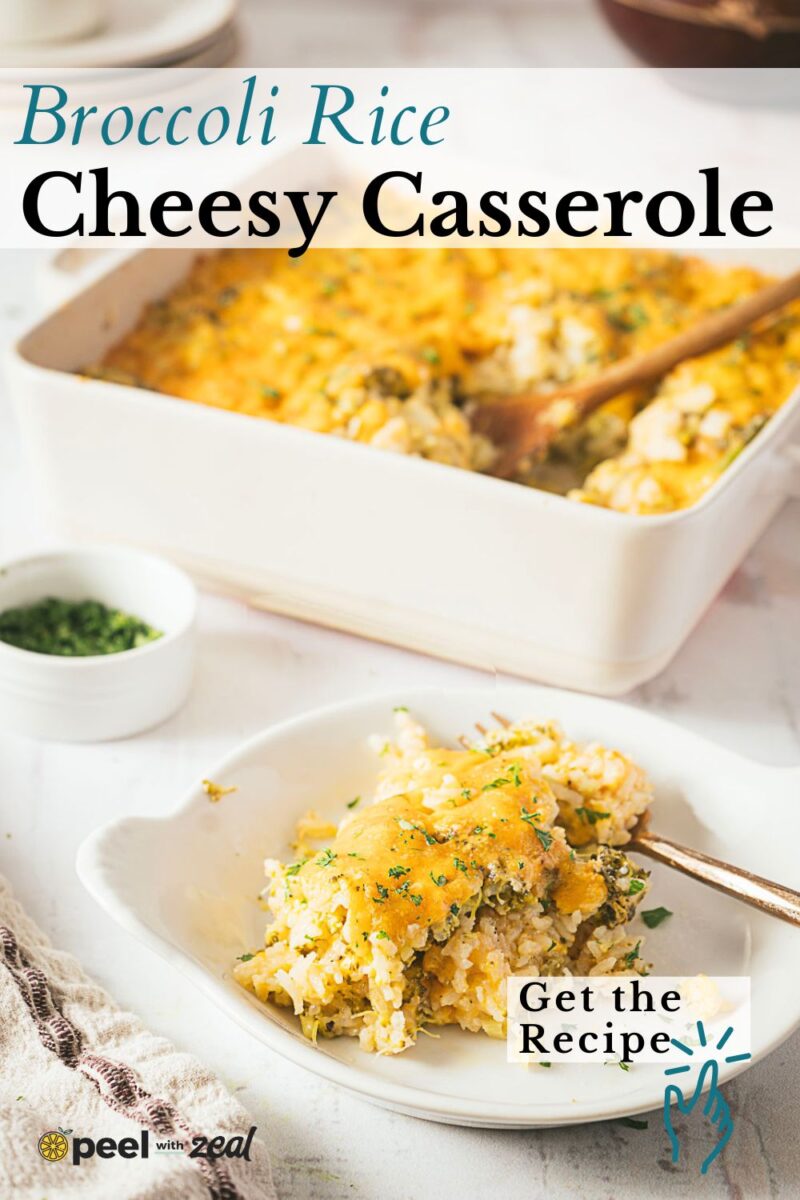 A serving of broccoli rice casserole on a white plate, with the main cheesy casserole dish and a wooden spoon in the background.