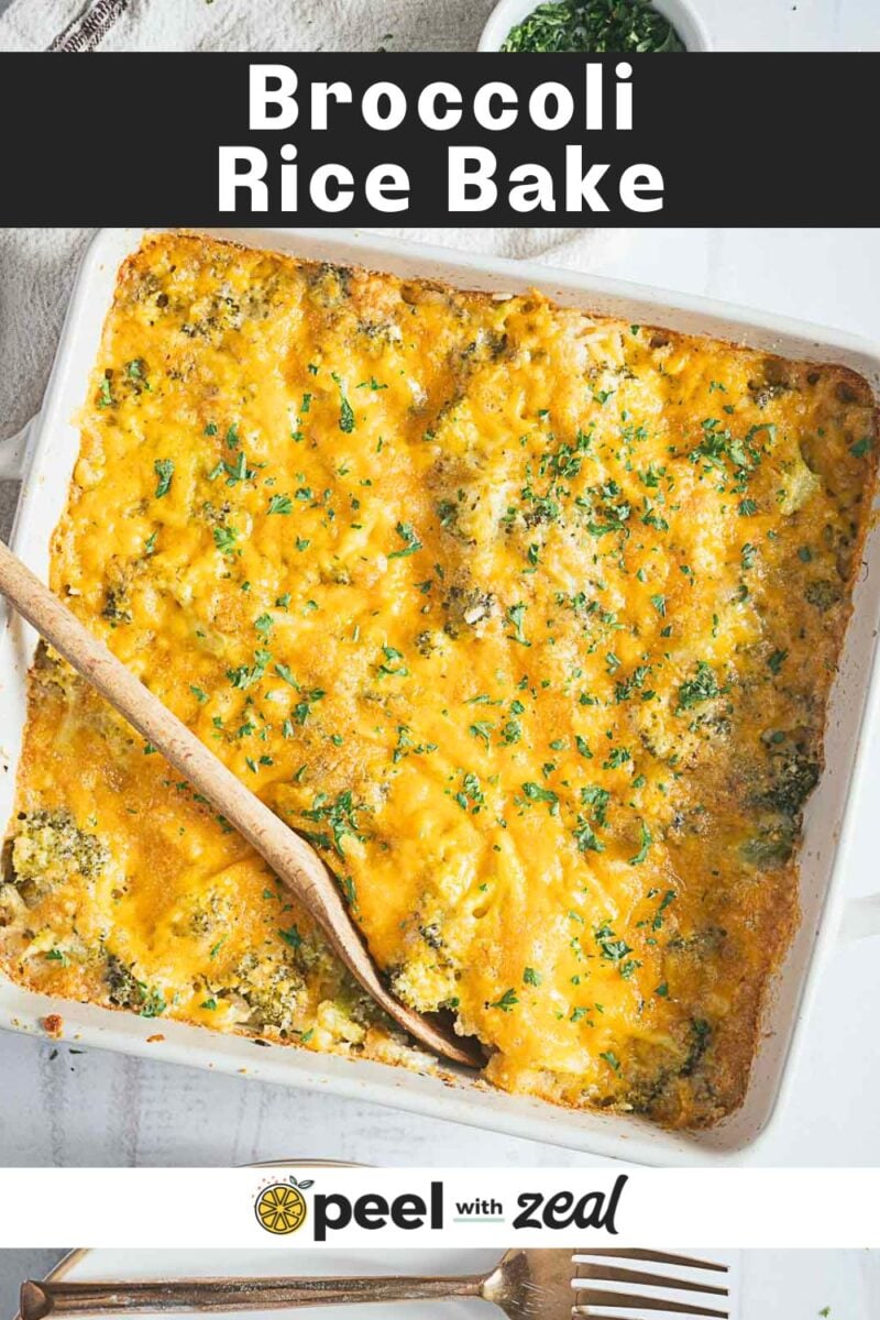 A baked casserole dish filled with cheesy broccoli rice casserole, garnished with chopped herbs. A wooden spoon rests inside the dish.