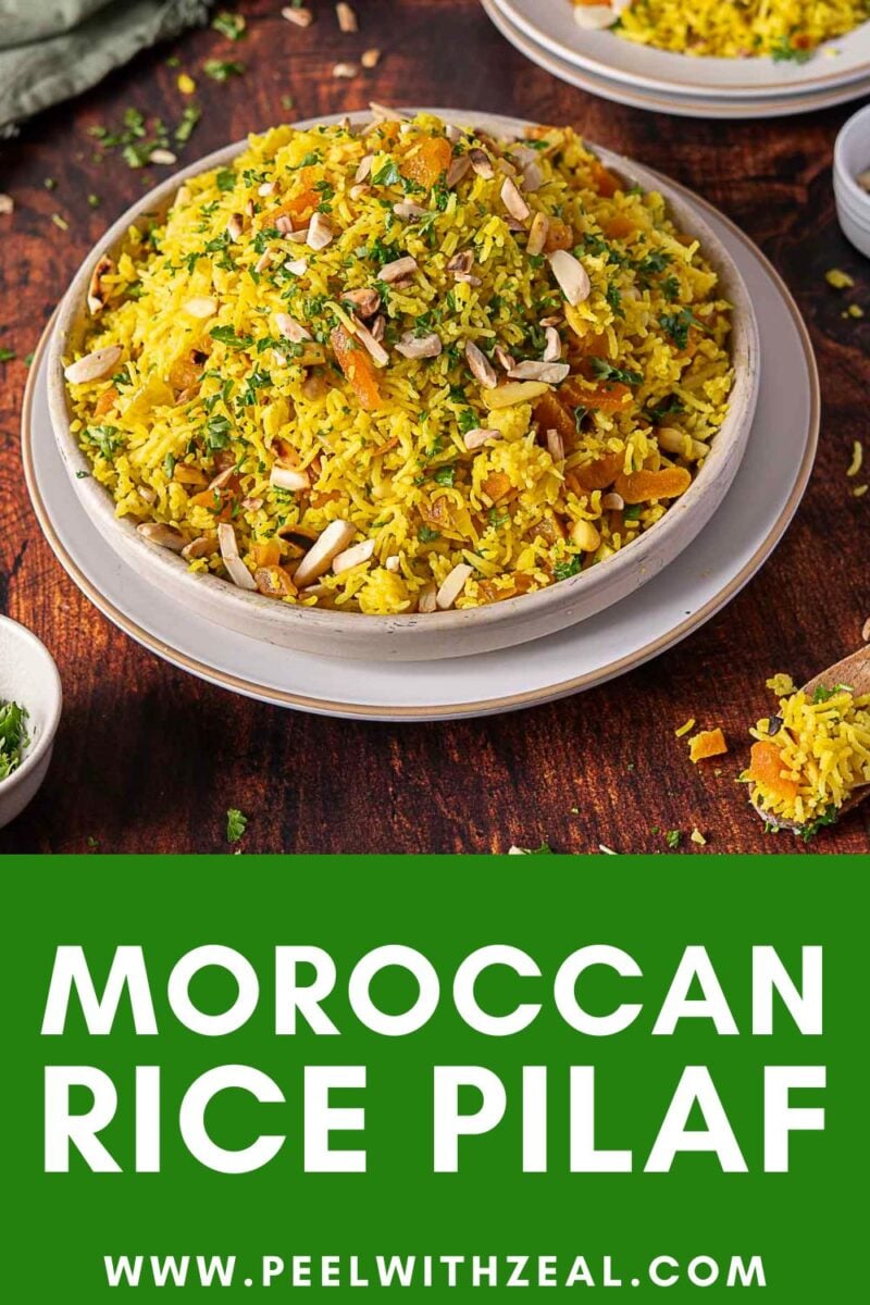 A bowl of Moroccan rice pilaf garnished with herbs and sliced almonds sits on a wooden table, with the text "Moroccan Rice Pilaf" and website "peelwithzeal.com" below.