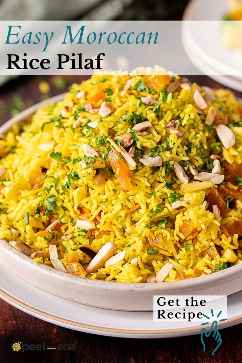 A bowl of yellow Moroccan rice pilaf garnished with sliced almonds and herbs, with a “Get the Recipe” text overlay in the bottom right corner.