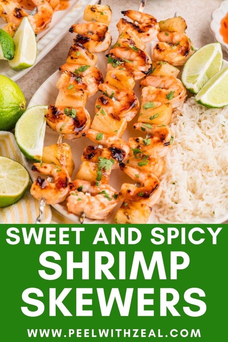 Grilled shrimp skewers garnished with herbs and lime, served with white rice on a plate; text reads "Sweet and Spicy Shrimp Skewers www.peelwithzeal.com".