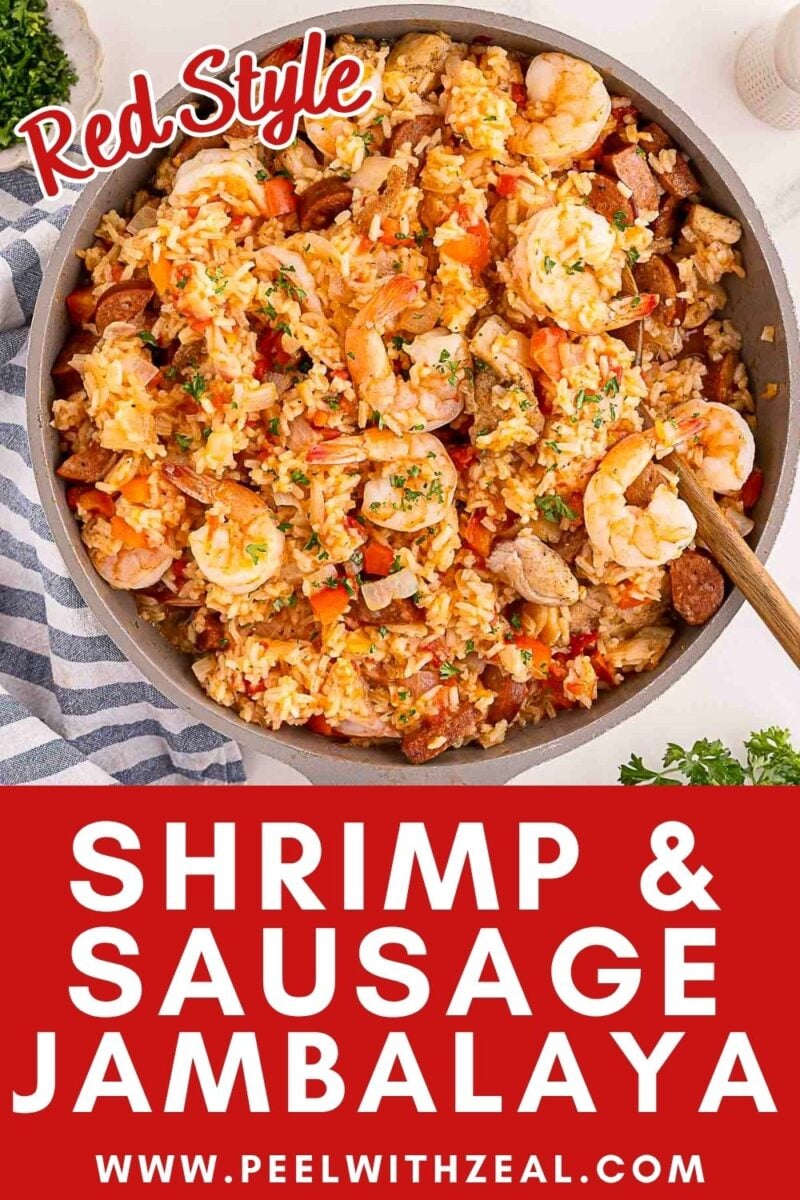 A pan of creole jambalaya featuring shrimp and sausage, mixed with rice, peppers, and herbs, is shown with a wooden spoon. Text overlay reads “Shrimp & Sausage Jambalaya, www.peelwithzeal.com.”.