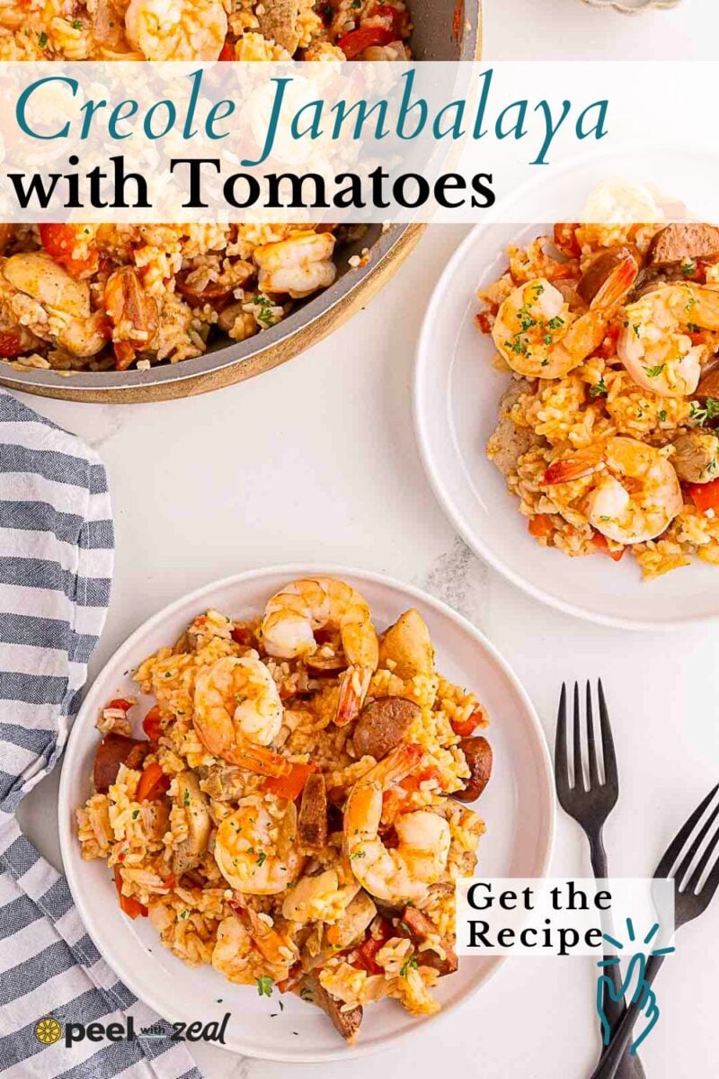 Three plates of savory creole jambalaya, brimming with shrimp, sausage, rice, and vegetables, are served on a white table with black forks and a striped napkin.