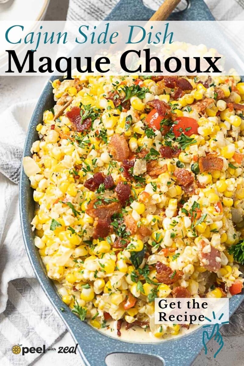 Skillet filled with Maque Choux, a Cajun corn-based dish with bacon, tomatoes, peppers, and herbs, presented as a savory side dish.