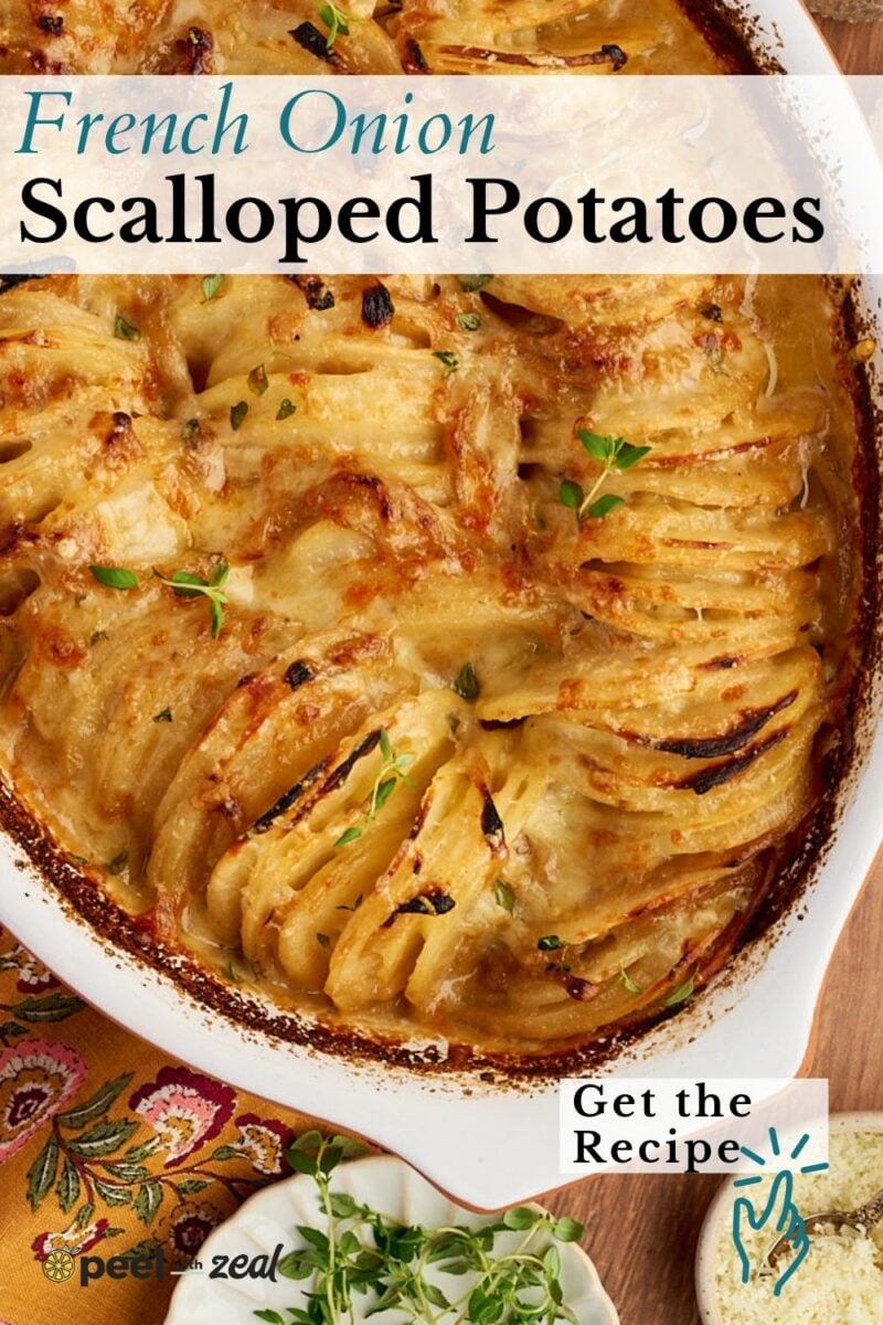 A casserole dish of French onion potatoes topped with herbs.